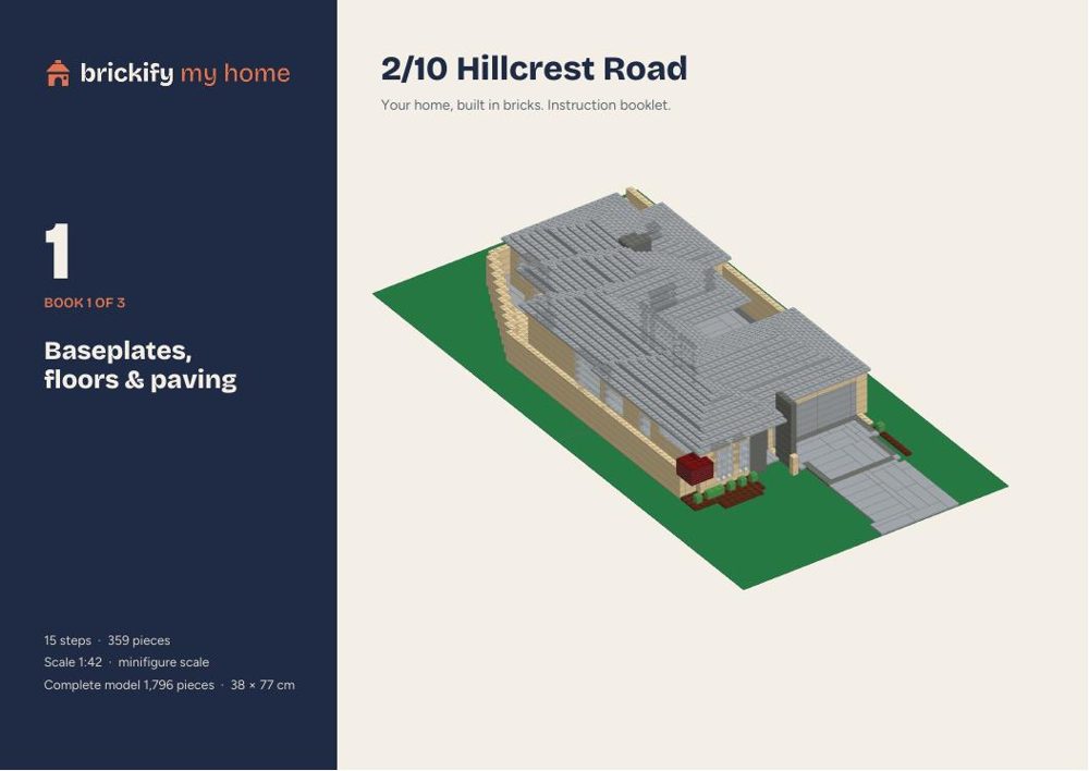 Cover of instruction book 1 of 3, showing the finished brick house.